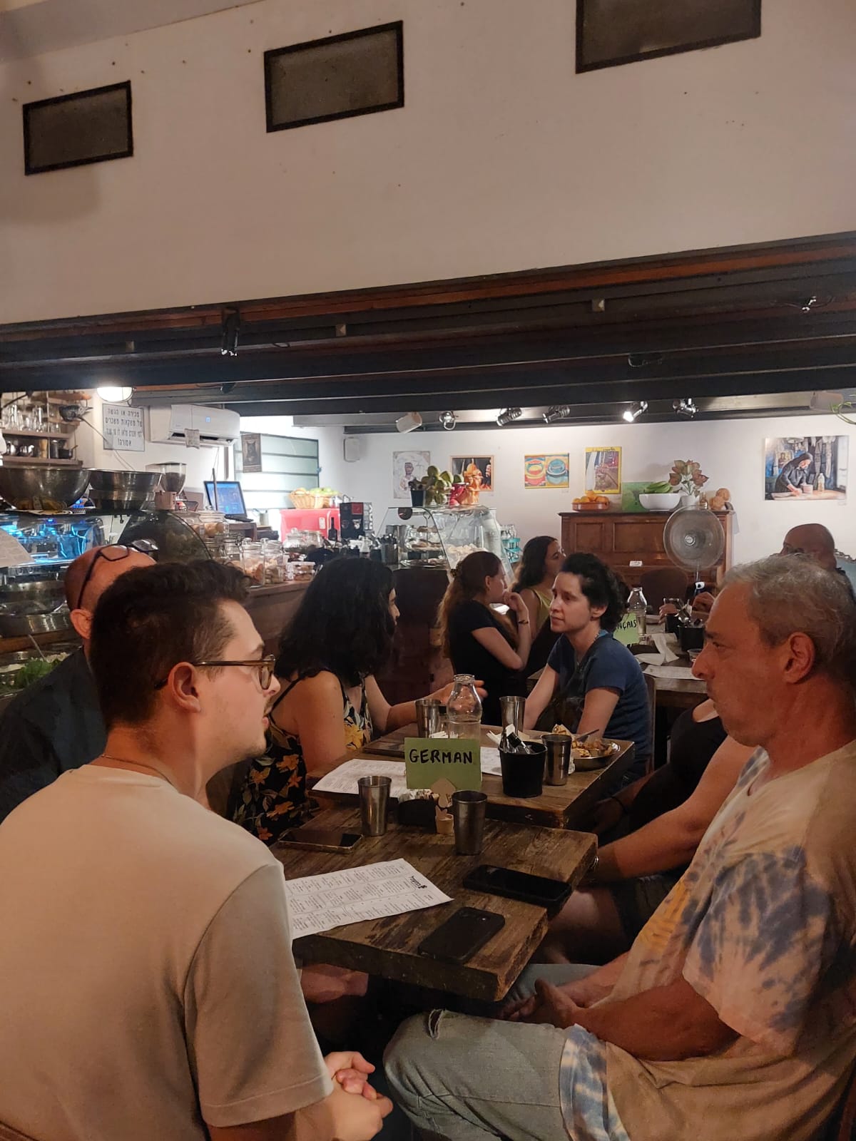 A group seated at the German language table at Tel-A-Lingo